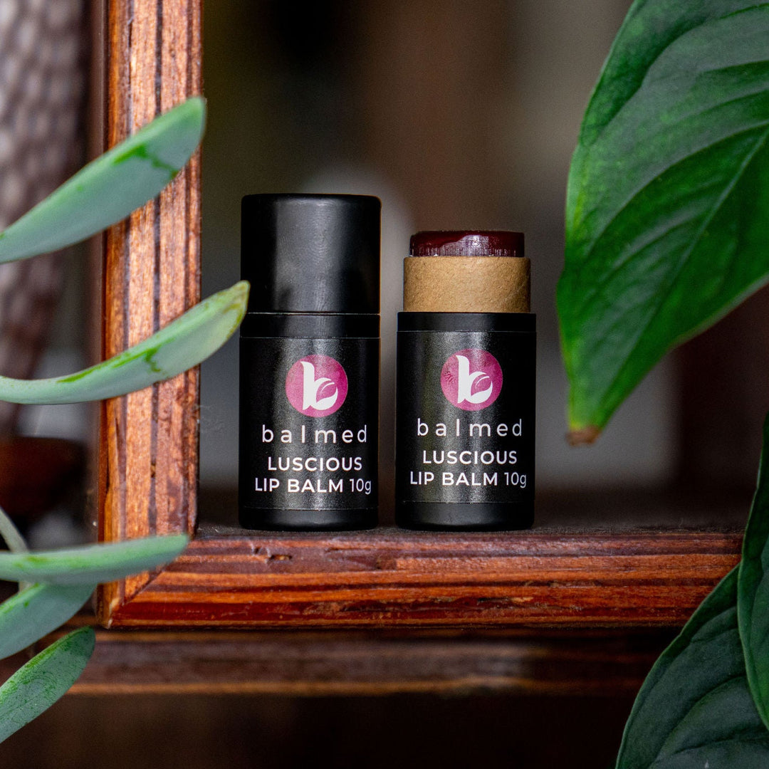 Natural Australian Lip Balm sticks on a wooden shelf