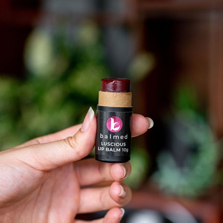 Female hand holding Australian lip balm stick